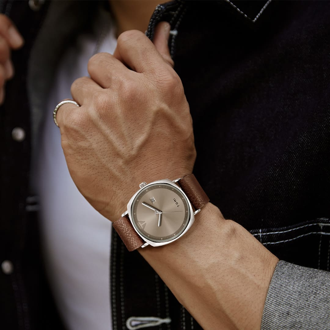 Man wearing Aurex Milano Heritage Leather Edition watch, displaying understated luxury and refined simplicity.