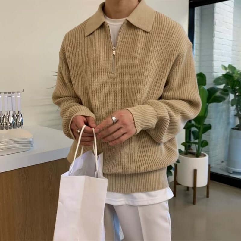Man wearing Briar Quarter Zip Sweater, showcasing warm and cozy winter style, crafted from soft jacquard knit fabric for men's winter knitwear.