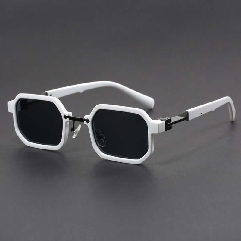 White octagonal sunglasses for men with bold, modern design on a dark background.