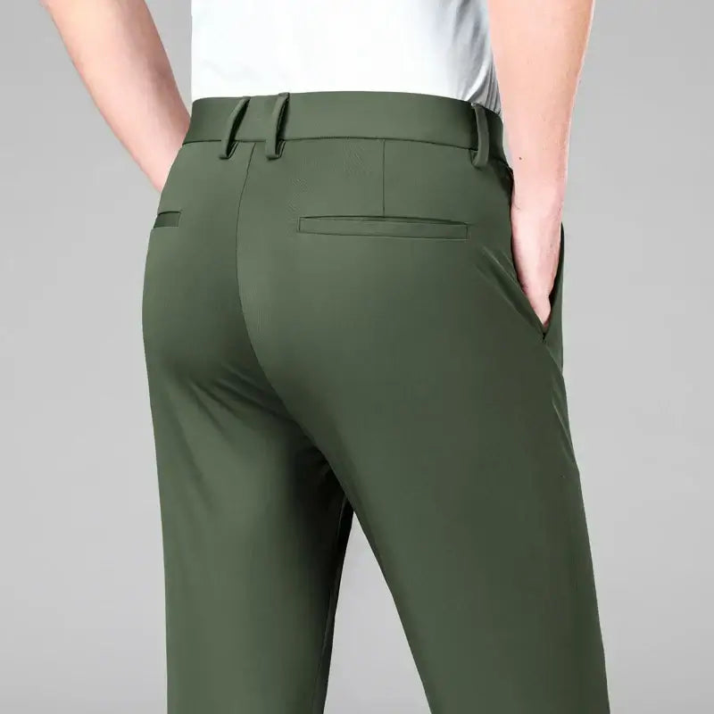 The Everyday Pants for men in green, showcasing breathable ice silk fabric and flexible fit for versatile casual and formal wear.