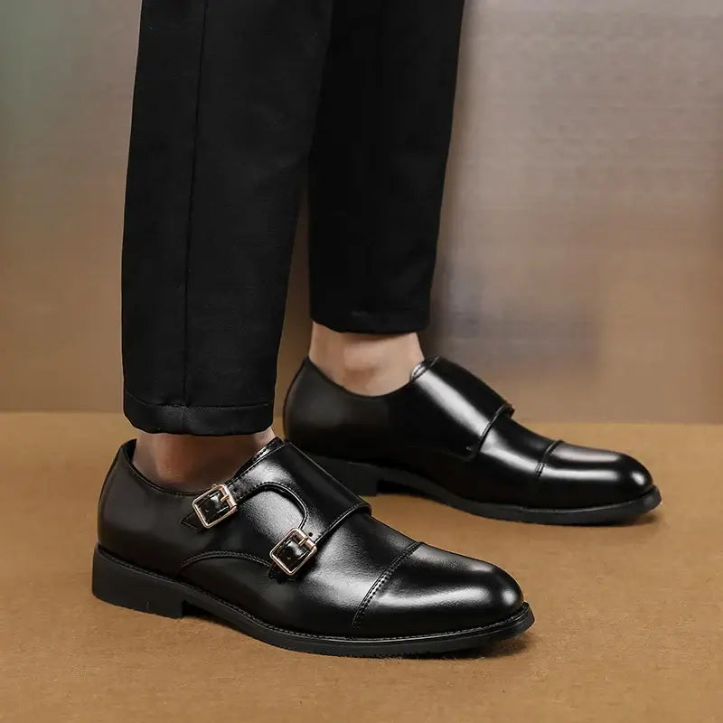 Person wearing Stratton Dress Shoes with double monk strap made of genuine leather, showcasing polished finish and comfort-focused sole.