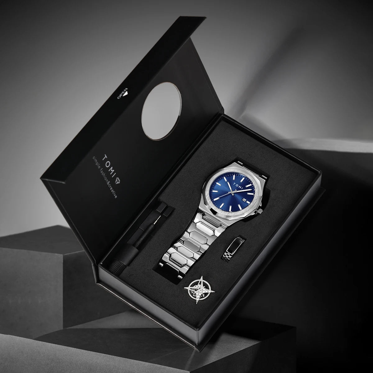 Northport Business Watch in gift box with stainless steel band and blue dial, showcasing minimalist design and complete calendar display.