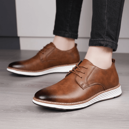 Person wearing Livorno Hybrid Shoes, genuine leather slip-ons with cushioned footbed and flexible sole, perfect for casual and business wear.