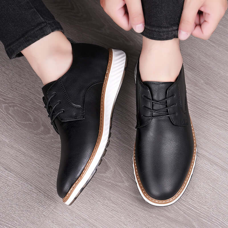 Person wearing Livorno Hybrid Shoes, handcrafted genuine leather with cushioned footbed, perfect for casual and business settings.