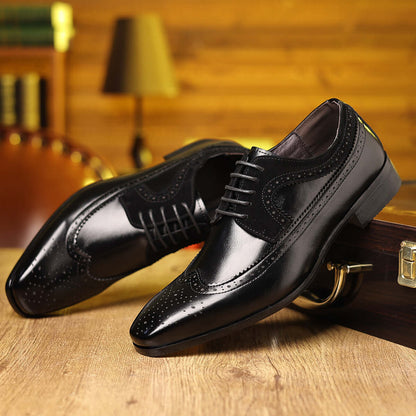 Milano Dress Shoes featuring sleek Italian leather and suede, orthopedic insoles for comfort, on a wooden floor with a leather chair in background