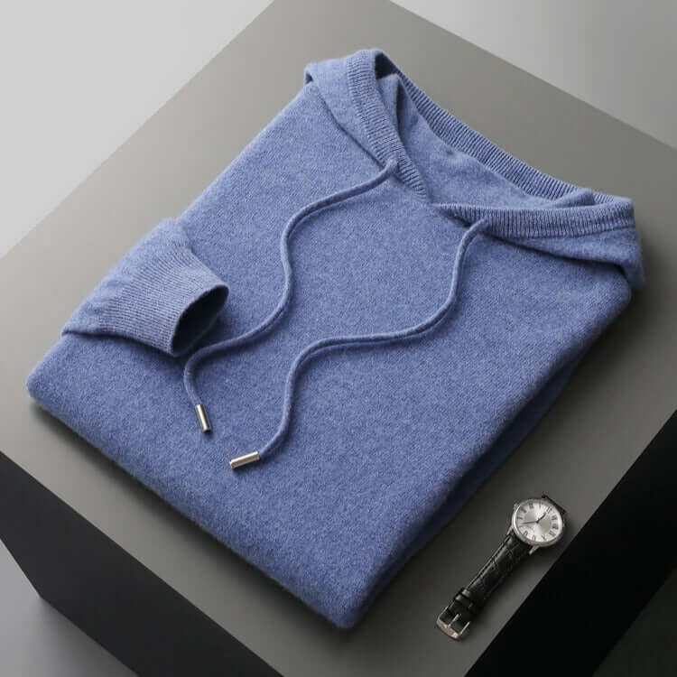 Monaco Hoodie in soft blue, crafted from 100% merino wool. Ultimate men's winter sweater offering unmatched warmth and comfort.