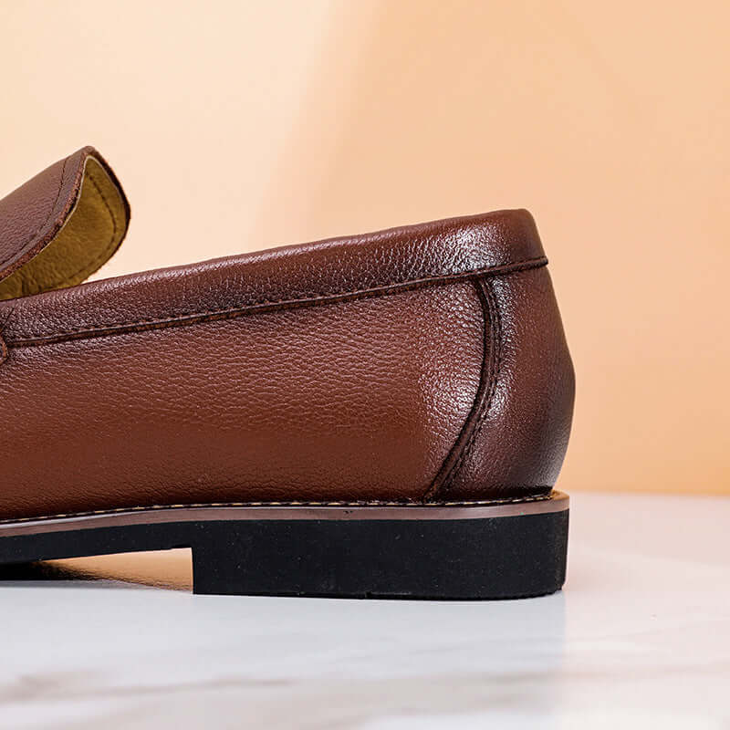 Regente Cowhide Leather Loafers showcasing elegant brown leather finish, perfect for formal wear. A premium slip-on option for modern men.